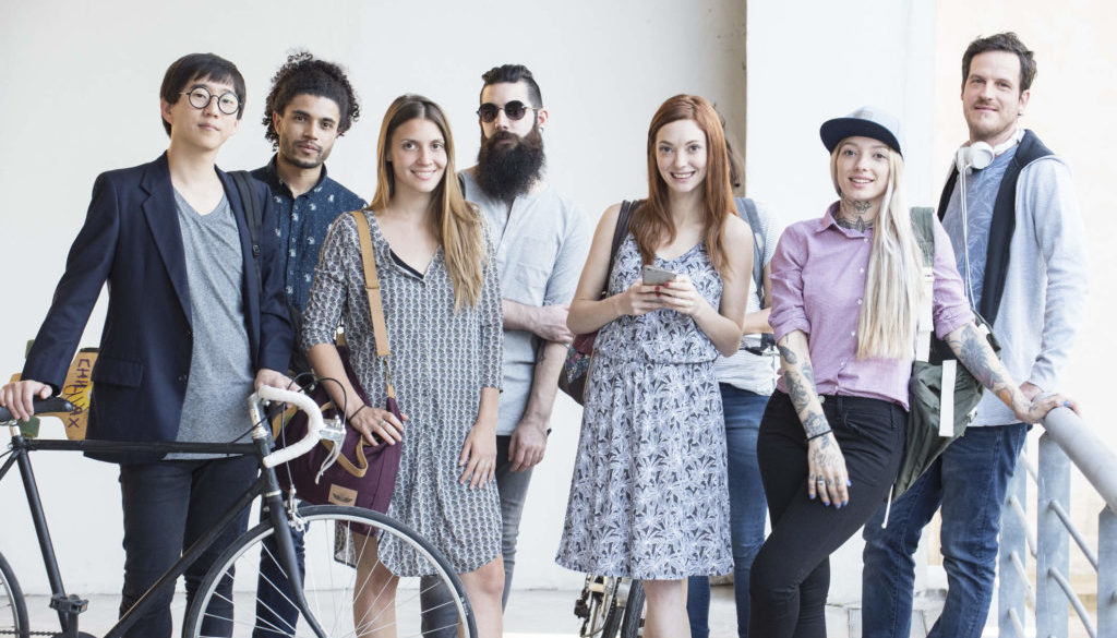 Group of hipsters standing together outdoors